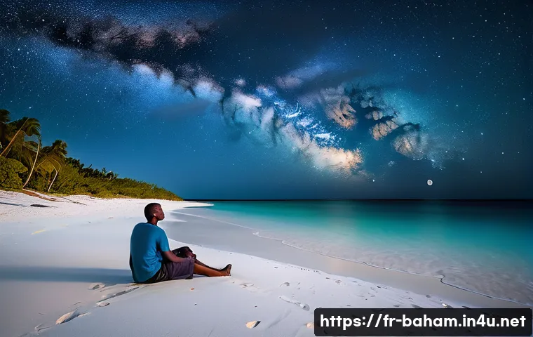 바하마에서 별 보기 좋은 장소 - A serene, isolated beach in the Bahamas at night, with soft white sand and gentle waves under a pitc...